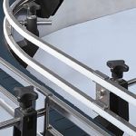 Curved conveyor side guides with adjustable black knobs and metal rails