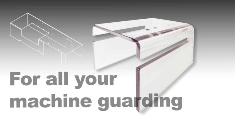 Clear plastic machine guarding barrier for safety and protection.