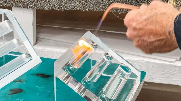 Acrylic test tubes and pipette for laboratory testing and scientific research purposes.
